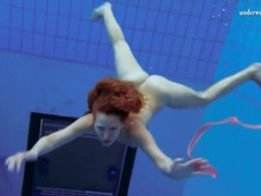 KiloTop presents: Curly hair redhead swims and looks sexy