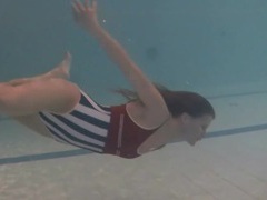 KiloTop presents: Leggy girl swims and strips naked in pool