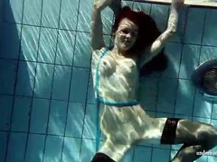 KiloTop presents: In black stockings pretty girl goes for a swim